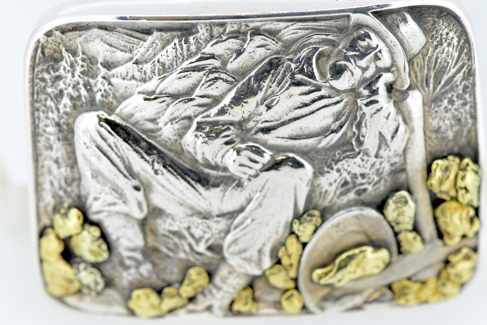 Belt buckle encrusted with gold nuggets and coins